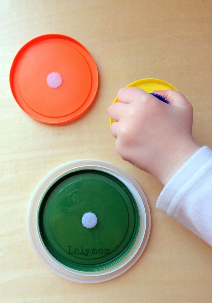 10 Fine Motor Activities for Toddlers Using Velcro - Nesting Velcro Lids- from Lalymom #SmartMarch #OccupationalTherapy #FineMotor