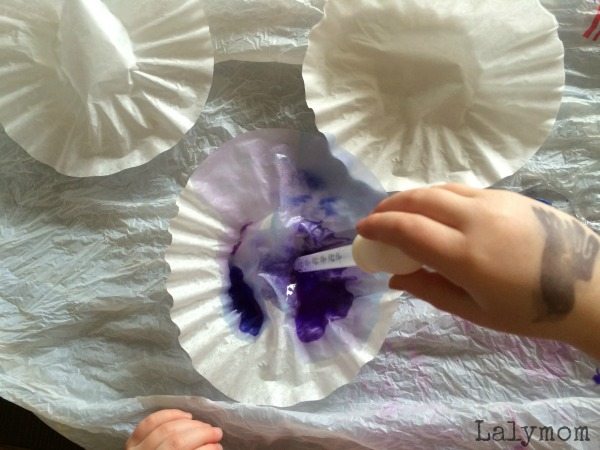 Coloring coffee filters with watercolors and eye dropers