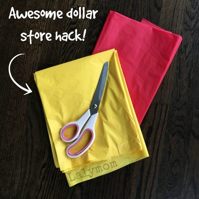 Awesome dollar store hack- Use a tablecloth for static cling party decorations!