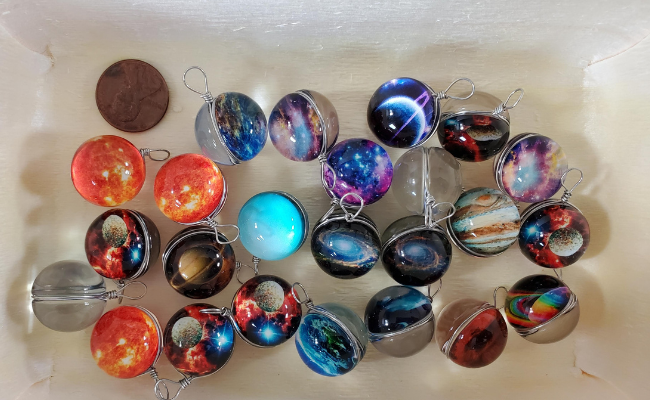 Photo of galaxy themed marble charms, the contents of a Universe Advent Calendar.